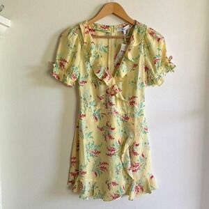 LIKELY yellow floral mini dress with ruffle details and tie back